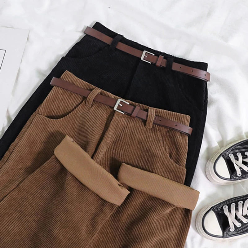 Model wearing new women's relaxed fit high-waisted corduroy trousers in a rich brown color.