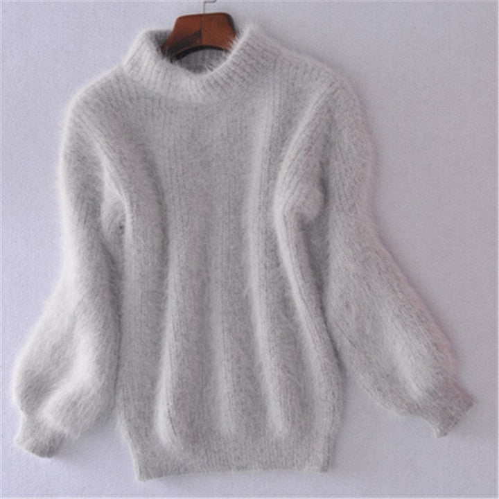 Model wearing a new women's mohair blend turtleneck sweater, demonstrating its relaxed fit and fall winter style