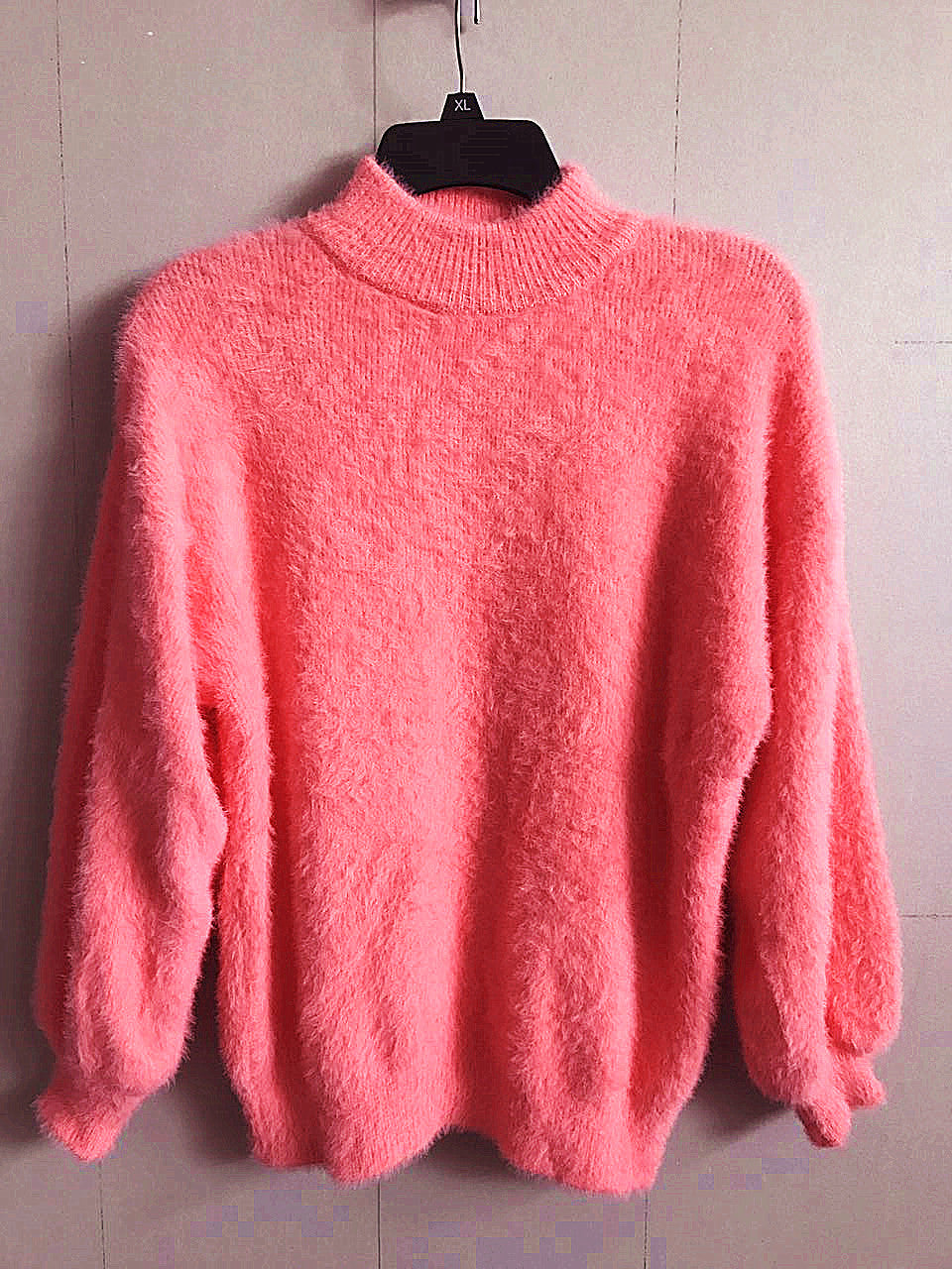 Back view of a new women's long sleeve mohair blend turtleneck sweater, displaying its relaxed fit and quality