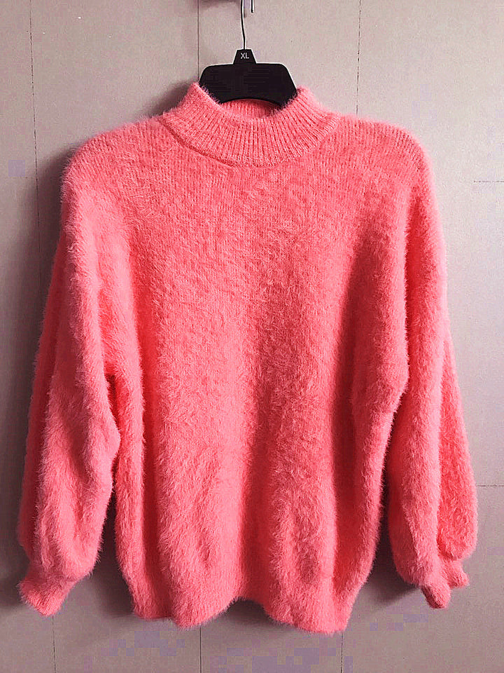 Back view of a new women's long sleeve mohair blend turtleneck sweater, displaying its relaxed fit and quality