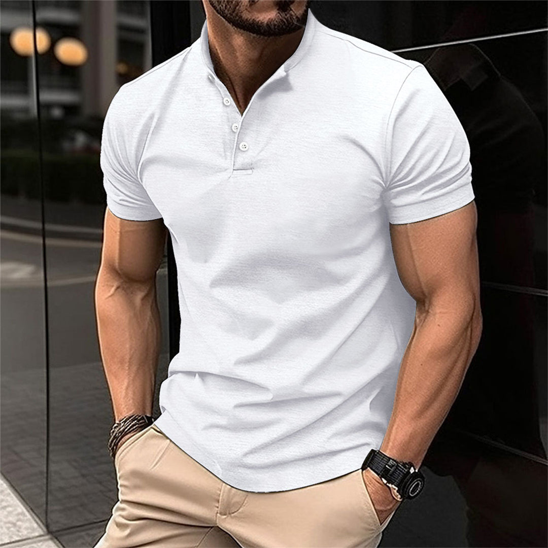 Man wearing a classic tailored polo shirt, short sleeve, showcasing its comfortable fit.