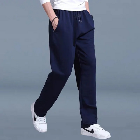Full shot of new men's casual pants, versatile for jogging or relaxing, blending fashion with activewear.