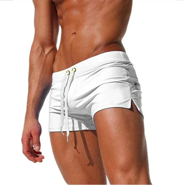New men's quick-dry swim trunks in blue with adjustable drawstring, ideal for beachwear & water sports.