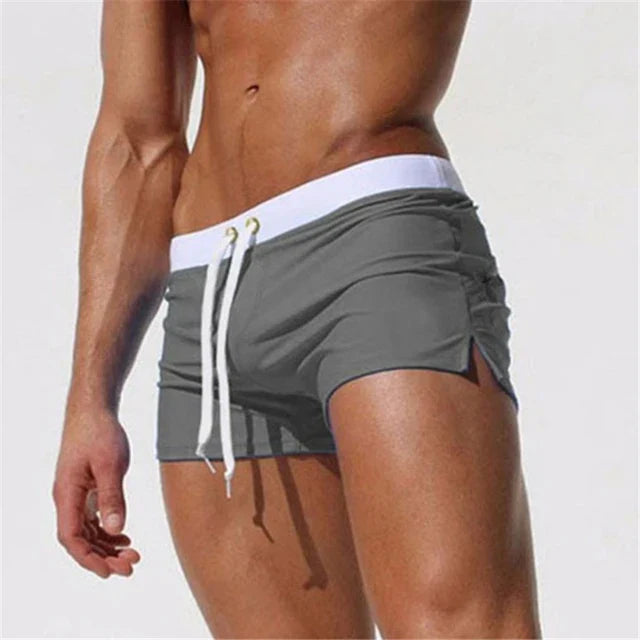 Stylish new men's swim shorts, quick-dry material, adjustable fit, great for beach volleyball & water sports.