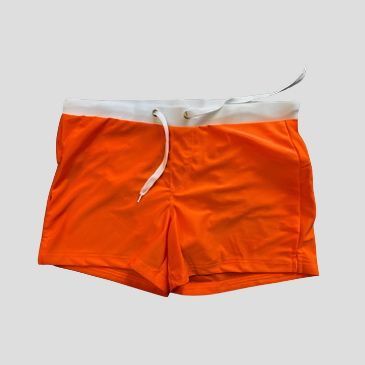 Comfortable men's quick-dry swim trunks with elastic waist & drawstring, suitable for all outdoor water fun.