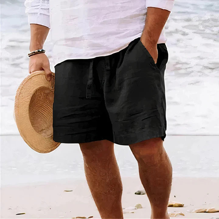 Men's relaxed fit linen shorts styled casually with a t-shirt, showcasing summer fashion