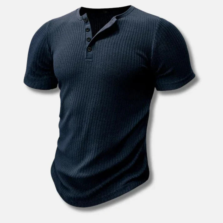 Close-up of a new men's slim-fit Henley t-shirt, showing the button placket and cotton blend fabric.