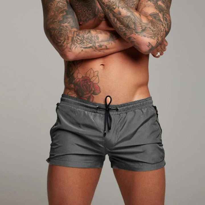 New men's stretchy quick-dry swim shorts in blue for beach & pool, perfect for summer fashion.