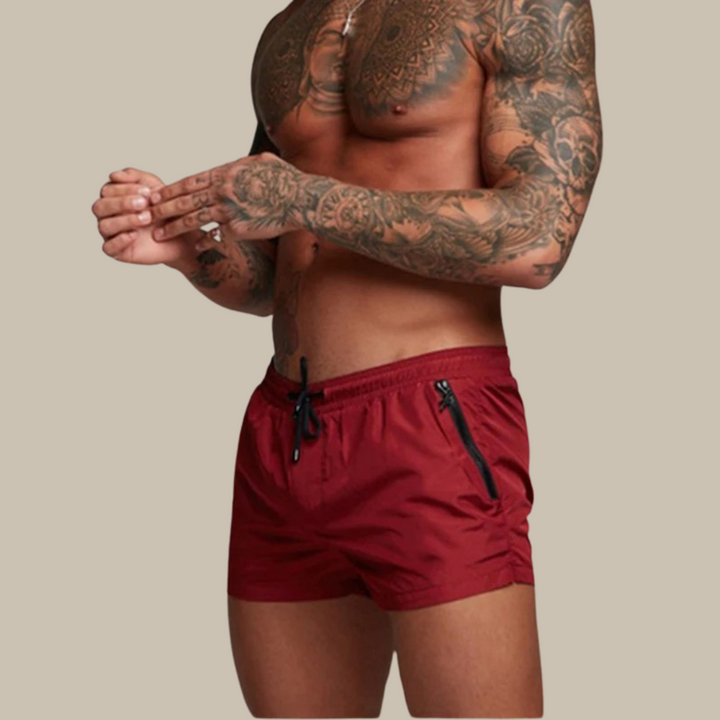 Performance men's quick-dry swim shorts, stretchy grey fabric, excellent men's apparel for summer.