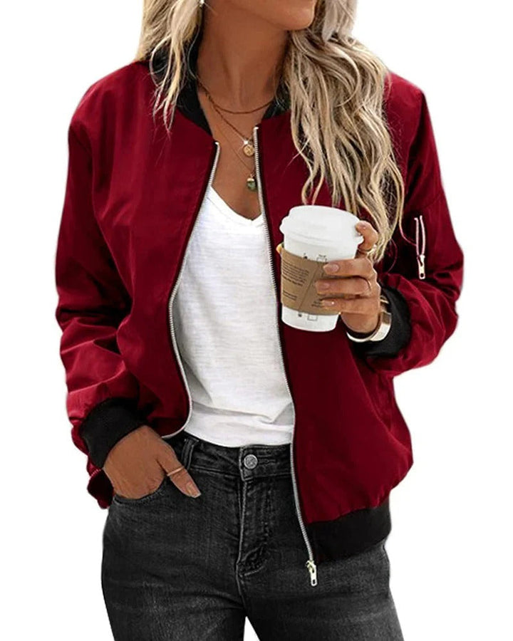 Side profile of a classic women's bomber jacket, emphasizing its casual yet chic aesthetic