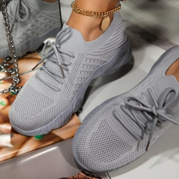 Pair of new women's breathable mesh athletic sneakers, designed for lightweight comfort and walking.