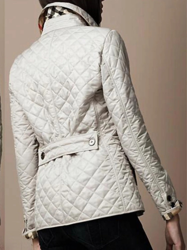 Lightweight women's quilted jacket in a classic cut, polyester fabric, suitable for cool weather