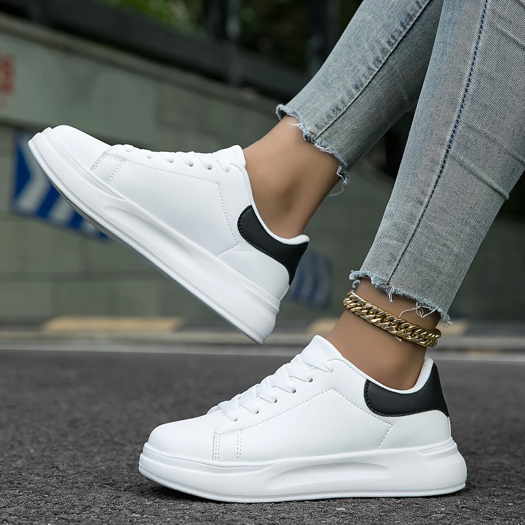 Comfortable white leather casual sneakers for women, featuring orthopedic support for all-day wear.