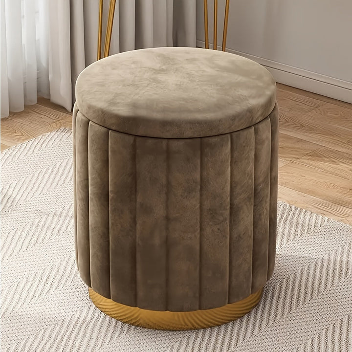 Elegant round storage pouf, perfect for modern interiors. Mirror accent & convenient storage.