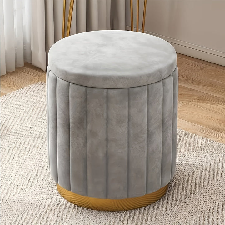 Fabric storage pouf with a chic mirror finish. Round ottoman for living room or bedroom.
