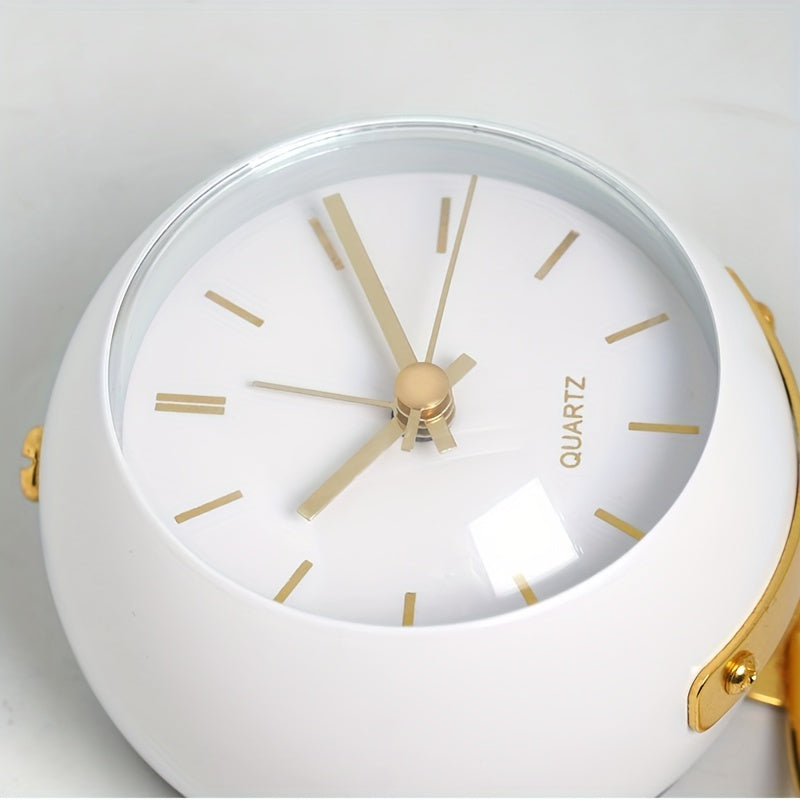 Contemporary silent desk clock with a sleek metal frame and luminous hands. Battery-operated timepiece.