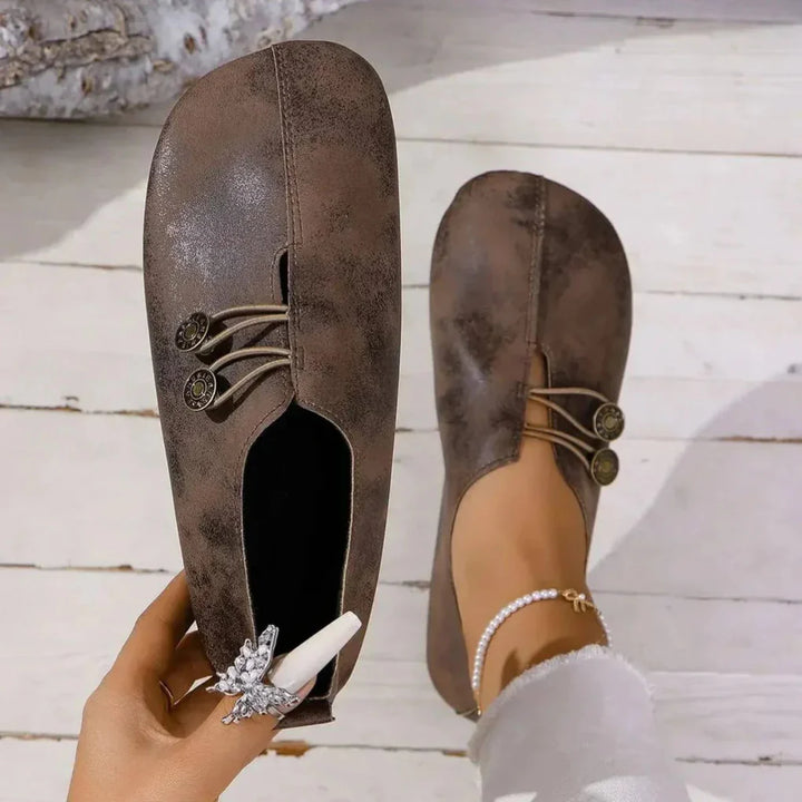Pair of women's casual orthopedic shoes, emphasizing lightweight construction and supportive features for comfort.