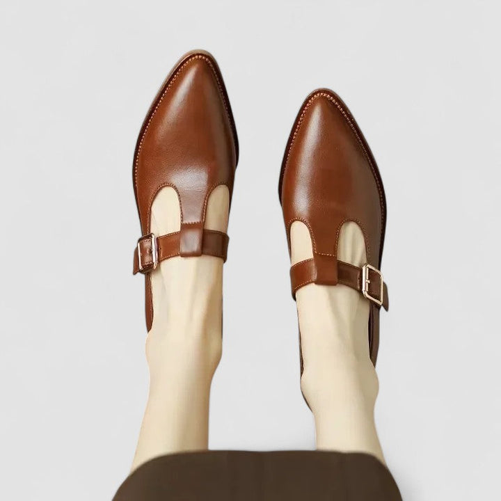 Women's comfort Mary Jane pumps with orthopedic support, pointed toe, and adjustable buckle strap in casual leather.