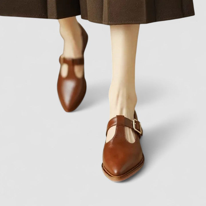 Classic black leather Mary Jane pumps for women, offering orthopedic comfort and a stylish pointed toe design.
