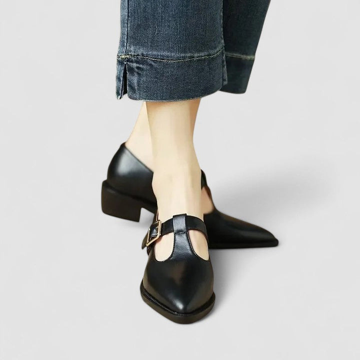 Comfortable women's orthopedic Mary Jane pumps, black leather with a pointed toe and secure buckle strap for daily wear.