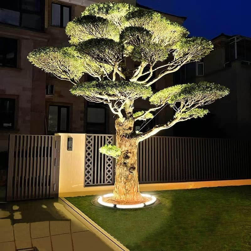 "Outdoor LED spotlights softly lighting tree bases with warm white glow, enhancing garden aesthetics with elegant aluminum de