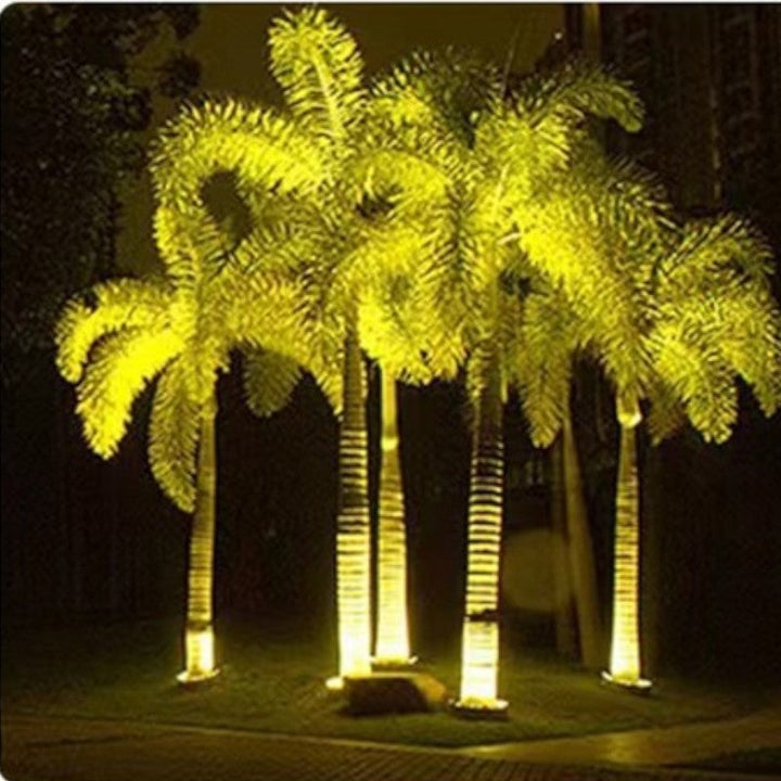 "Outdoor LED spotlights softly lighting tree bases with warm white glow, enhancing garden aesthetics with elegant aluminum de