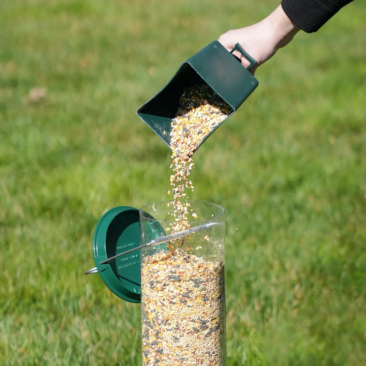 Easy-refill squirrel-resistant bird feeder for outdoor use, featuring a spinning perch to deter pests.