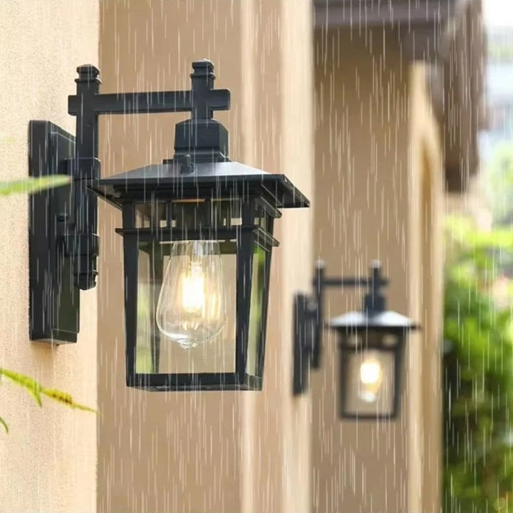 Modern rustic outdoor wall lantern, waterproof black copper fixture ideal for porch & patio lighting.