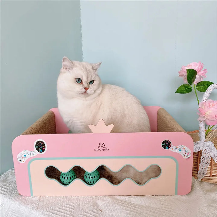 Complete pink multi-level cat play and scratch tower featuring scratching posts, interactive toys, & a comfy bed.