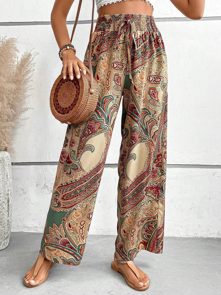 Pink women's bohemian wide-leg trousers with slanted pockets, perfect for casual wear. Ankle length.