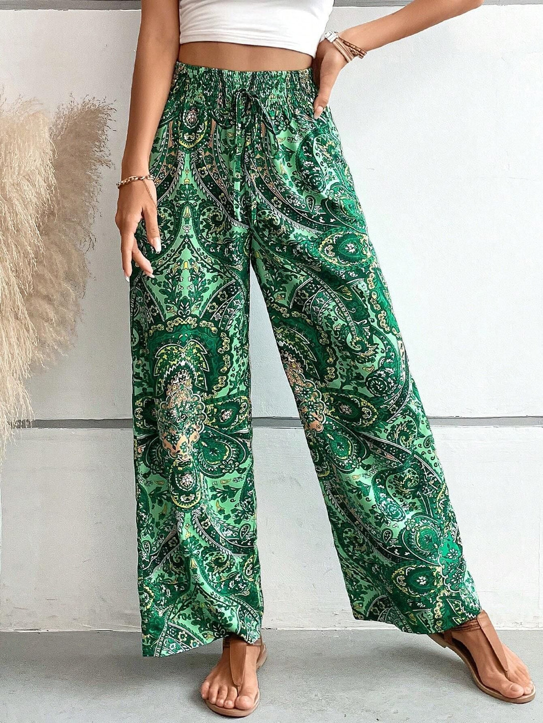 Green women's casual mid-rise wide-leg trousers with slanted pockets, stylish and comfortable.
