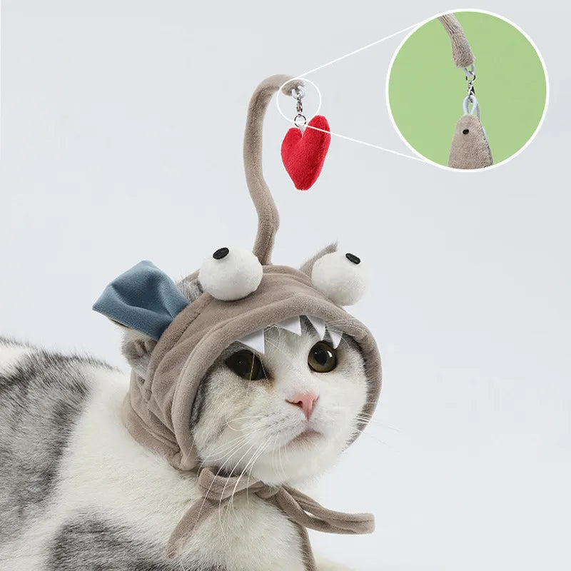 Cat playing with an interactive feather toy attached to a cute pet costume hat.