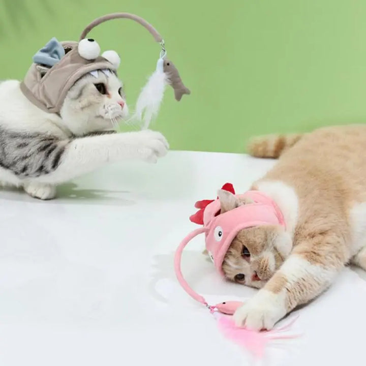 Soft cat hat accessory with a dangling feather pendant, perfect interactive toy for playful felines.