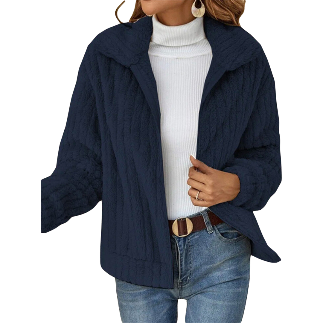 Warm women's winter jacket made of plush fleece, close-up of texture, showing softness