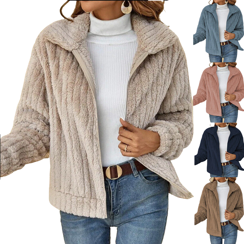 Detail of a women's sherpa fleece winter jacket pocket, highlighting practical features