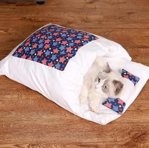 Washable plush cat bed, a warm and cozy sleeping bag for pet comfort.
