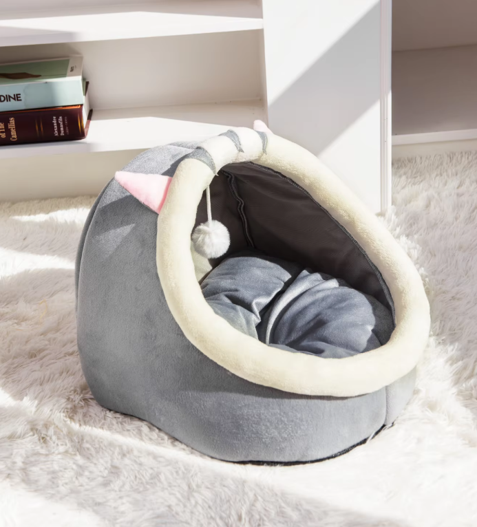 Cozy cat igloo bed cave, a plush hideaway for cats to sleep and play with the integrated toy ball.