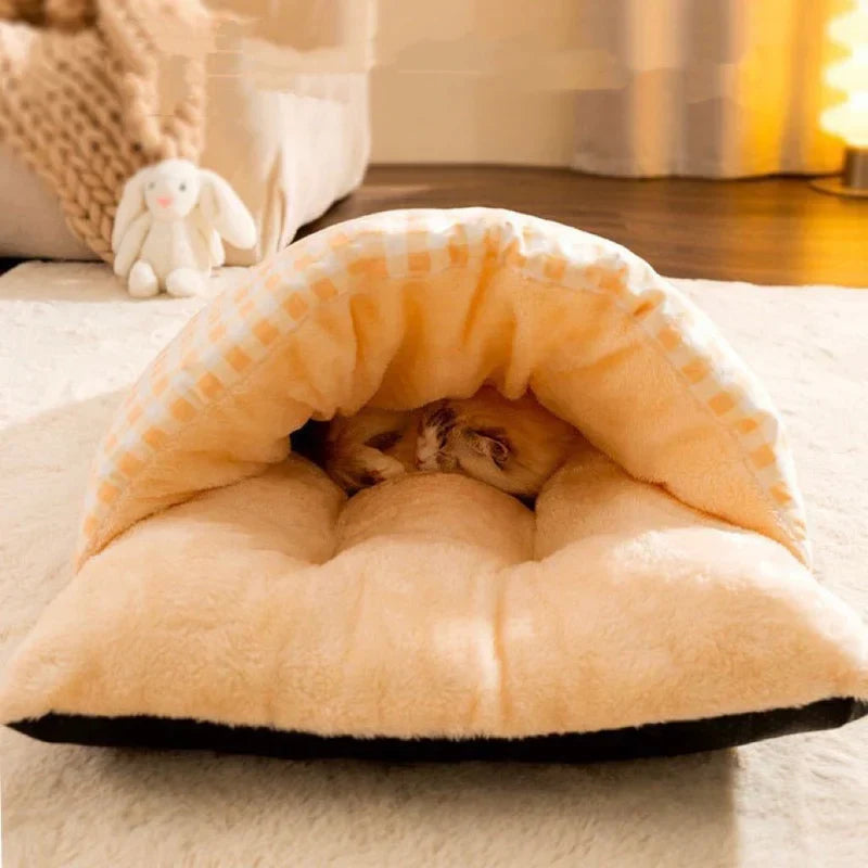 Washable plush cat sleeping bag bed for a clean & cozy nap spot. Warm pet bed for feline comfort.