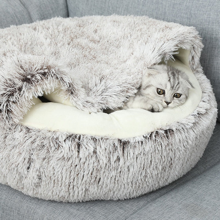 Cozy plush cave bed for cats & small dogs. Soft, washable pet sanctuary providing snuggle comfort.