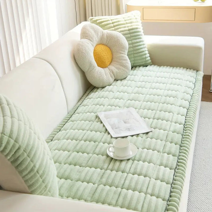 Plush sofa protector mat with soft fleece texture & non-slip backing for ultimate furniture protection.