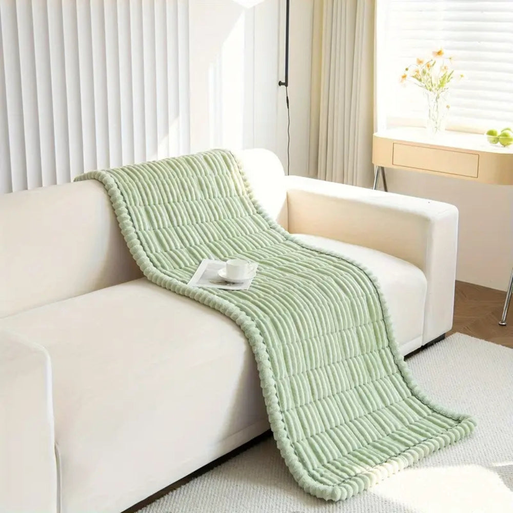 Cozy plush sofa mat with non-slip fleece texture for effective furniture protection and inviting home comfort.