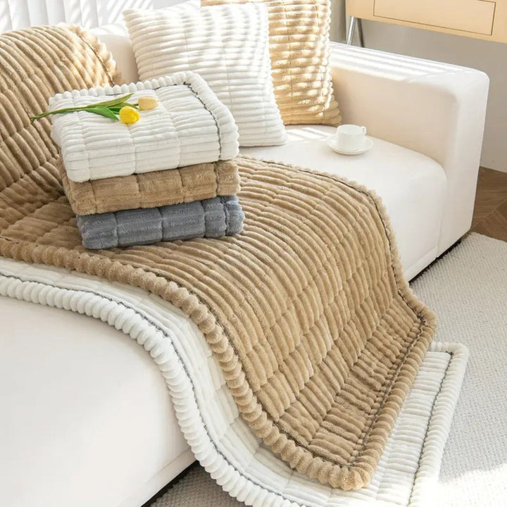 Quilted plush sofa protector mat, soft fleece, non-slip, ensures comfort & guards your furniture from daily wear.