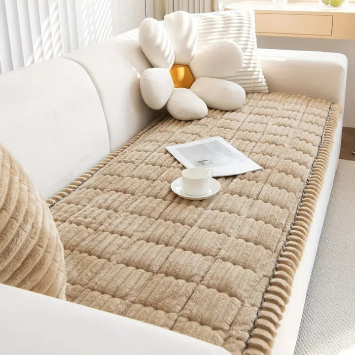 Soft fleece plush sofa protector mat, quilted for extra comfort and durability, with non-slip backing.