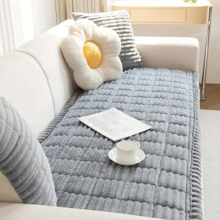 Enhance living room with plush, fleece sofa protector mat; non-slip & stylish furniture cover for comfort.