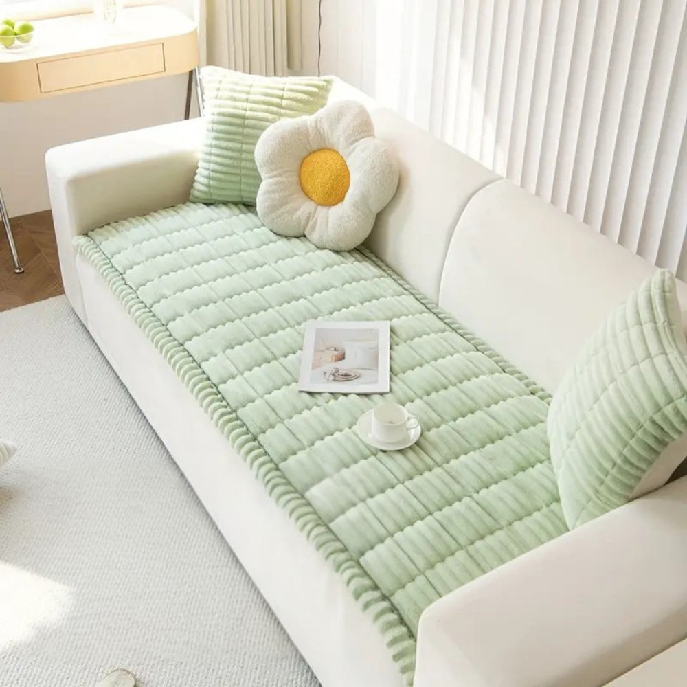 Pet-friendly plush sofa protector mat, non-slip fleece cover for couches, protects from spills & pet damage.