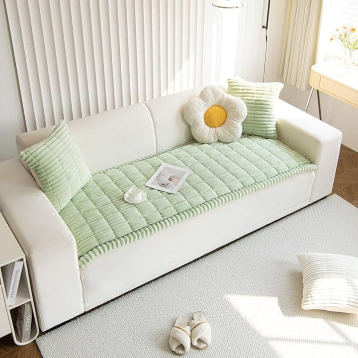 Plush sectional sofa protector mat, fleece textured, non-slip, offering cozy furniture defense for large couches.