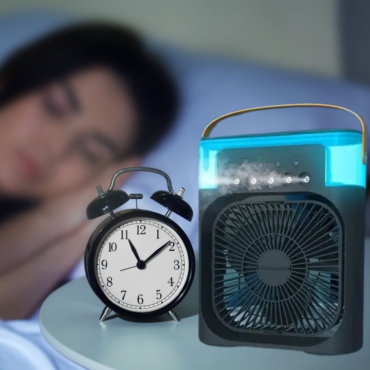 Compact personal fan, air cooler, and humidifier for bedroom or office.