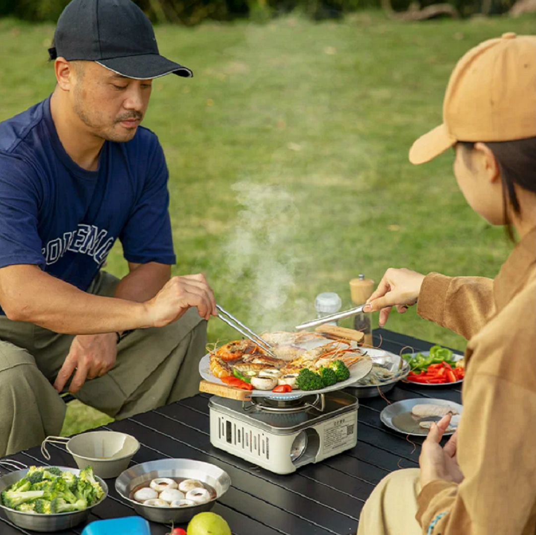 Outdoor cooking gas stove, powerful and portable, essential gear for campers and hikers.