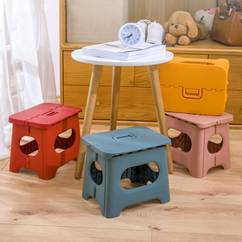 Lightweight folding step stool with carry handle, portable and convenient for compact home storage, kids & adults.