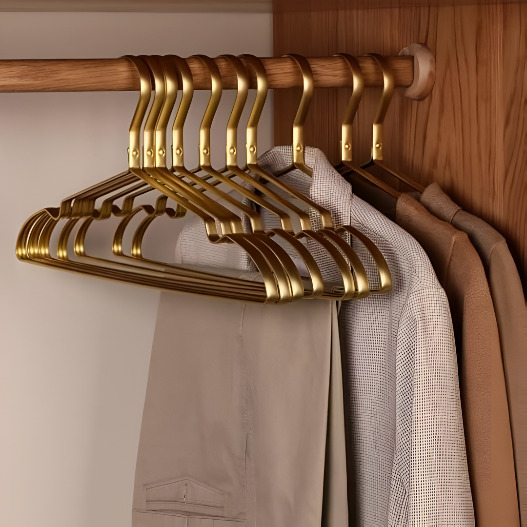 Durable anti-slip aluminum coat hangers in black or gold, ideal for space-saving wardrobe organization and garment care.